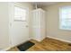A basic mud room area featuring tiled floors and a louvered door at 118 Park Ave, Knightdale, NC 27545
