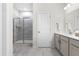 Bathroom with a glass enclosed shower with tile surround, quartz countertop and white cabinetry at 120 Longspur Ln, Rolesville, NC 27571