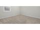 Comfortable bedroom with neutral carpet, white trim, and a bright window at 120 Longspur Ln, Rolesville, NC 27571