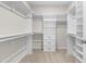 A large walk-in closet with built-in shelving and plenty of storage space at 120 Longspur Ln, Rolesville, NC 27571