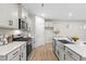 Beautiful kitchen featuring white cabinets, stainless steel appliances, and a center island with seating at 120 Longspur Ln, Rolesville, NC 27571