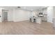 An open-concept space with a modern kitchen with grey cabinets, countertops, and seating at the kitchen island at 120 Longspur Ln, Rolesville, NC 27571