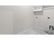 Well-lit laundry room with tile flooring and modern utility hookups at 120 Longspur Ln, Rolesville, NC 27571