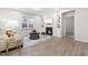 A cozy living room featuring a fireplace with built-in shelves and stylish decor at 120 Longspur Ln, Rolesville, NC 27571