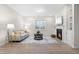 Comfortable living room area with a fireplace, built-in shelving, and lots of natural light at 120 Longspur Ln, Rolesville, NC 27571