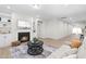 A well-lit living room showcases a fireplace, built-in shelving, and wood flooring at 120 Longspur Ln, Rolesville, NC 27571