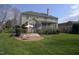 Exterior backyard view featuring a deck with patio set and screened porch at 12321 Penrose Trl, Raleigh, NC 27614