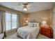 Cozy bedroom featuring a comfortable bed with ornate headboard and neutral decor at 12321 Penrose Trl, Raleigh, NC 27614