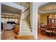 Open foyer showcasing hardwood floors, staircase, living room, and dining room at 12321 Penrose Trl, Raleigh, NC 27614