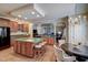 Well-lit kitchen with a center island, breakfast bar, and open access to the dining and living areas at 12321 Penrose Trl, Raleigh, NC 27614
