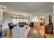 Spacious living room featuring hardwood floors, fireplace and large windows at 12321 Penrose Trl, Raleigh, NC 27614