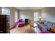 Cozy living room with hardwood floors, plush seating, and natural light at 12321 Penrose Trl, Raleigh, NC 27614