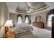 Spacious main bedroom boasts tray ceiling, large windows, and ample natural light at 12321 Penrose Trl, Raleigh, NC 27614