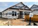 New construction showing covered front porch and construction site details at 130 W Saltgrass Ln, Smithfield, NC 27577