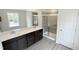 Spacious bathroom featuring double vanity, shower with sliding glass door, and tile accents at 140 Gobbler Dr, Smithfield, NC 27577