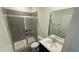 Bathroom featuring a glass-enclosed shower, toilet, and vanity with sink, and a mirror at 140 Gobbler Dr, Smithfield, NC 27577