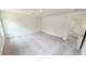 Spacious bedroom with neutral carpet, white walls, and access to an adjoining room at 140 Gobbler Dr, Smithfield, NC 27577