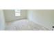 A bright bedroom with a window and unfinished flooring ready for customization to fit personal taste at 140 Gobbler Dr, Smithfield, NC 27577