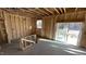 Unfinished garage space ready for customization with window and sliding door at 140 Gobbler Dr, Smithfield, NC 27577