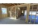 Interior view of an unfinished space with wood framing and staircase at 140 Gobbler Dr, Smithfield, NC 27577