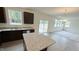 Bright living area with a stainless steel dishwasher and sliding doors at 140 Gobbler Dr, Smithfield, NC 27577