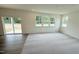 Well-lit living room features neutral carpet and sliding door access at 140 Gobbler Dr, Smithfield, NC 27577