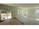 Sunny living room with a sliding glass door and multiple windows, creating a bright and airy atmosphere at 140 Gobbler Dr, Smithfield, NC 27577