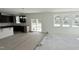 Bright living room with large windows and sliding glass doors, perfect for entertaining guests at 140 Gobbler Dr, Smithfield, NC 27577