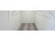 Spacious walk-in closet featuring neutral walls, carpeting, and metal shelving units for organization at 140 Gobbler Dr, Smithfield, NC 27577