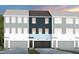 Charming new townhomes with a modern design featuring unique colors and attached garages at 1416 Chrysalis Pl, Apex, NC 27502