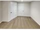 Basement area featuring two white doors and neutral carpet at 143 George Wilton Dr, Clayton, NC 27520