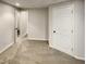 Basement featuring doors and neutral carpet at 143 George Wilton Dr, Clayton, NC 27520