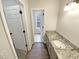 Bathroom with new flooring, granite countertops, and upgraded features at 143 George Wilton Dr, Clayton, NC 27520