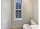 Well-lit bathroom with a bright window and neutral tiling at 143 George Wilton Dr, Clayton, NC 27520