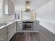 Modern kitchen with stainless steel appliances, new countertops, and dark wood flooring at 143 George Wilton Dr, Clayton, NC 27520