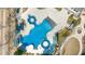 The aerial view features the community pool, which includes multiple swimming areas, lounge chairs, and umbrellas at 144 Sabiston Ct, Cary, NC 27519