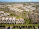 An aerial view showcases the harmonious layout of a residential area with tree-lined streets at 144 Sabiston Ct, Cary, NC 27519