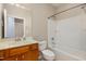 A bathroom features a single sink and vanity with a framed mirror, as well as a bathtub at 144 Sabiston Ct, Cary, NC 27519