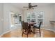 Cozy dining area with a wood table, stylish chairs, and sliding door at 144 Sabiston Ct, Cary, NC 27519
