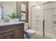 Well-appointed bathroom featuring a modern vanity, stylish fixtures, and a sleek glass-enclosed shower at 1475 Hasse Ave, Apex, NC 27502