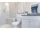 Modern bathroom with glass-enclosed shower and stylish vanity with white marble at 1481 Hasse Ave, Apex, NC 27502