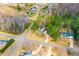 An aerial view showing the house surrounded by trees in a neighborhood at 153 Dell Meadows Pl, Four Oaks, NC 27524