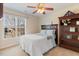 Bright bedroom with large window, neutral carpet, and light-colored bedding at 153 Dell Meadows Pl, Four Oaks, NC 27524