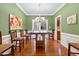 Elegant dining room with hardwood floors, decorative lighting, and ample seating, perfect for hosting dinner parties at 153 Dell Meadows Pl, Four Oaks, NC 27524