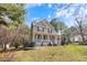 Beautiful home featuring a classic design and a meticulously landscaped front yard at 153 Dell Meadows Pl, Four Oaks, NC 27524