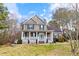 Charming two-story home with a welcoming front porch and well-maintained lawn at 153 Dell Meadows Pl, Four Oaks, NC 27524