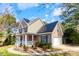 Attractive home equipped with solar panels and an attached two-car garage at 153 Dell Meadows Pl, Four Oaks, NC 27524