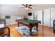 Bright game room features a billiard table, light hardwood floors, and recessed lighting fixtures at 153 Dell Meadows Pl, Four Oaks, NC 27524