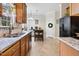 Charming kitchen featuring wooden cabinets, granite countertops, and an inviting breakfast nook for casual dining at 153 Dell Meadows Pl, Four Oaks, NC 27524