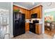 Well-equipped kitchen with appliances, granite countertops, and a functional layout for culinary enthusiasts at 153 Dell Meadows Pl, Four Oaks, NC 27524